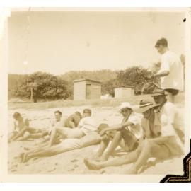 Family photograph from the Quelch Forno collection : Group of men on a beach