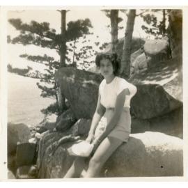 Family photograph from the Quelch Forno collection : Unidentified woman sitting on a rock