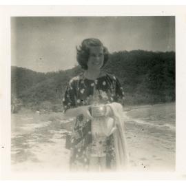 Family photograph from the Quelch Forno collection : Woman on a beach with a Box Brownie camera