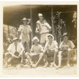 Family photograph from the Quelch Forno collection : Group of men holding pineapples