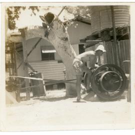 Family photograph from the Quelch Forno collection : George Scarlett at engine behind rec hut, Magnetic Island