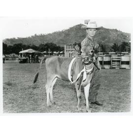 Philip Simpson at the 1965 Townsville Show with the Champion Junior Female of the Dairy Section, 9 July 1965