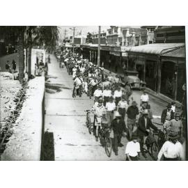 Procession of people in Flinders Street after the peace announcement, Townsville, 15th August 1945