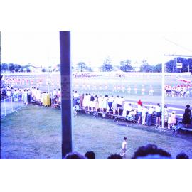 Mass display of marching teams at the championships, Townsville showgrounds, 1962