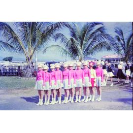 Northernaires Junior Marching Team with team leader Diane Robins, Townsville showgrounds, 1963