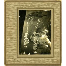 John Fairfield Barber collection : Mr. Barber with his flowering orchid