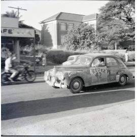 Car 42 in the Redex Trial 1955 on Ingham Road, Townsville. West End Primary School is in the background