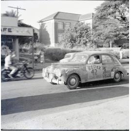 Car 42 in the Redex Trial 1955 on Ingham Road, Townsville. West End Primary School is in the background