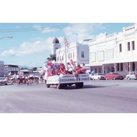 Townsville City Council float featuring the Entertainment in Parks programme in a parade on Denham Street, May 1981