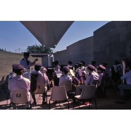 Band and conductor at an event at the Soundshell, South Townsville, 1985