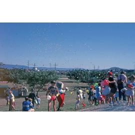 Children and balloons at an event at the Soundshell, South Townsville, September 1985