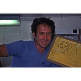 Coral ecologist Terry Done holding a data board