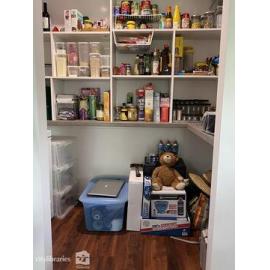 Household pantry stocked with cyclone kit pre-Cyclone Kirrily