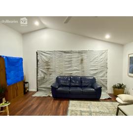 Tarp covering sliding glass doors during Cyclone Kirrily