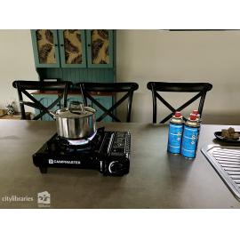 Boiling water on a camp stove during power outage caused by Cyclone Kirrily