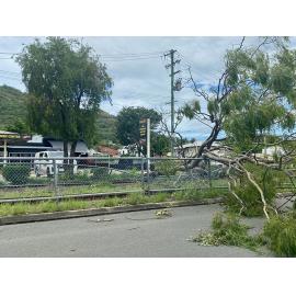 Police vehicle blocking traffic on Ingham Road, West End due to power line crossing road caused by Cyclone Kirrily