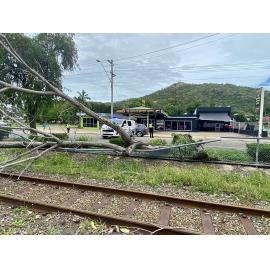 Police officers directing traffic on Ingham Road, West End due to power line crossing road caused by Cyclone Kirrily