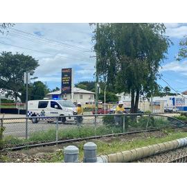 Ergon Energy staff inspecting fallen power line caused by Cyclone Kirrily on Ingham Road, West End 