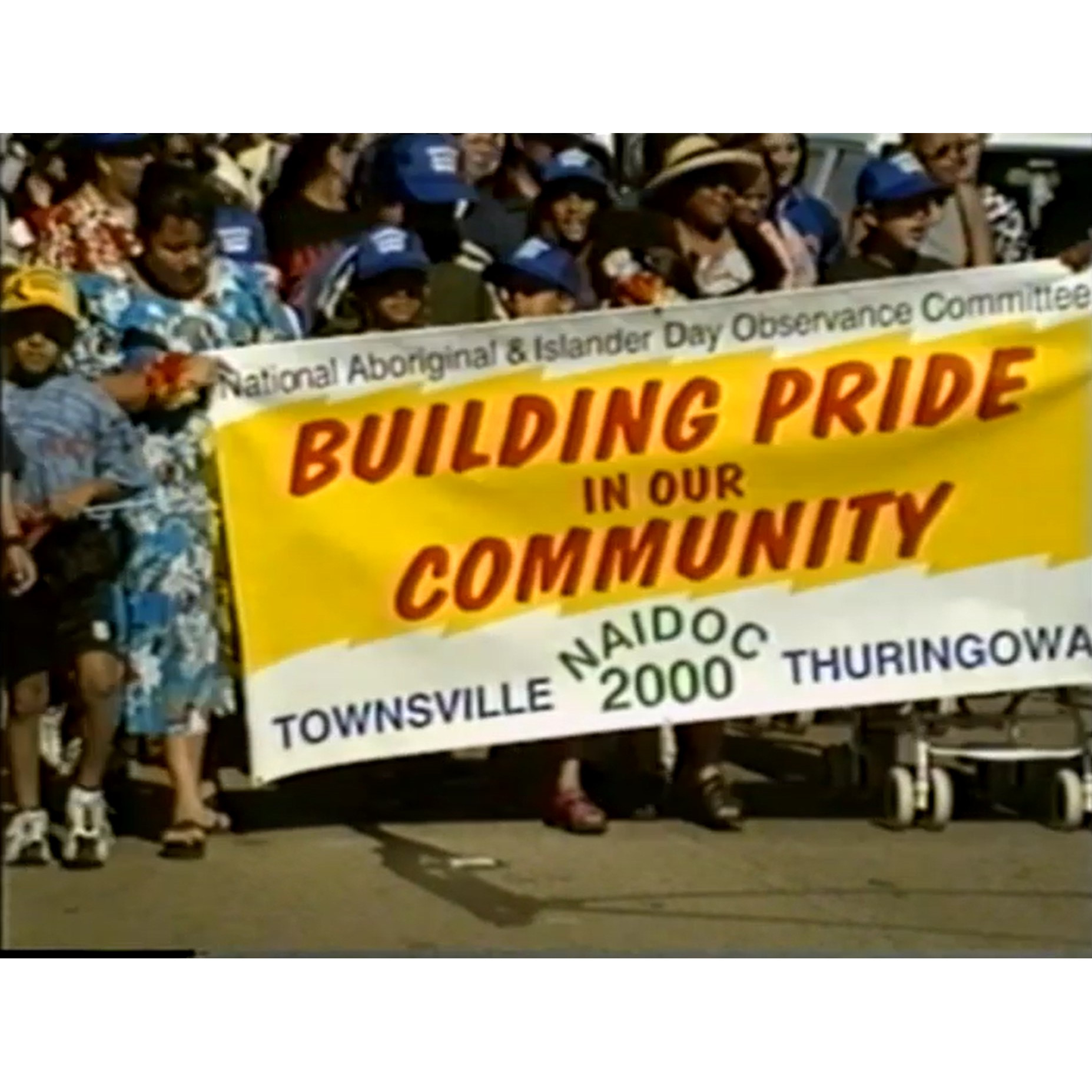 10 minutes of NAIDOC march, Uncle Bill 2 flags near end