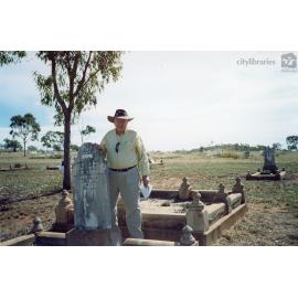 Pat O'Brien at the gravestone of Harriet Clark and James Clark, n.d.