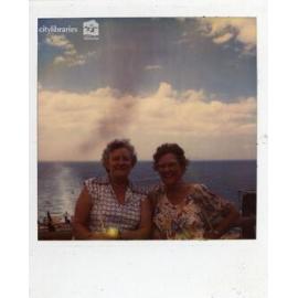 Two women posing at the seaside, ca. 1970