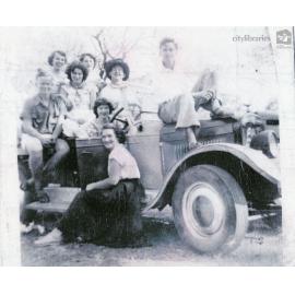Group of friends posing on Pat O'Brien's 1928 Chev National Tourer, Townsville, August 1955