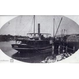 Boat docked at wharves, Townsville, n.d.