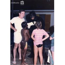 Children with a person dressed up as a monkey, Carramar Children's Home, Townsville, ca. 1995