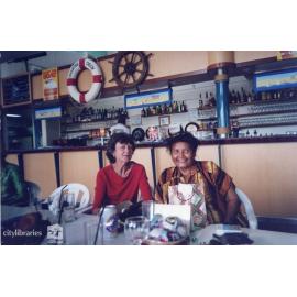 Jean Cole and friend at a restaurant, Townsville, ca. 1990