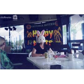 Staff member of Carramar Children's Home in an Easter Bunny mask at a restaurant, Townsville, ca. 1990