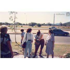 Staff of Therapeutic Adolescent Residential Assessment Unit (TARA) standing beside Woolcock Street, Townsville, ca. 1995