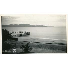 View of Magnetic Island from the swimming enclosure, The Strand, Townsville, ca. 1950