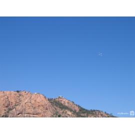 Pigeons flying over Castle Hill after being released at the launch of Cultural Fest 07, Townsville, August 2007