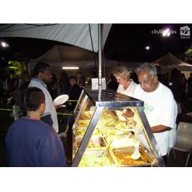 Staff serving food at Cultural Fest, Strand Park, Townsville, August 2007
