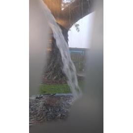 Rain pouring off roof at Aitkenvale library during weather event, 31 January 2025