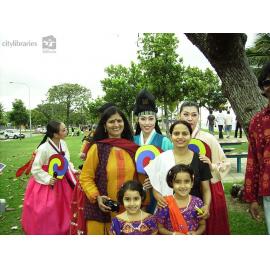 Performers from Suwon City Korea, with members of the Indian Cultural Society after the Tropigo Carnival parade at Cultural Fest, The Strand, Townsville, 18 August 2007