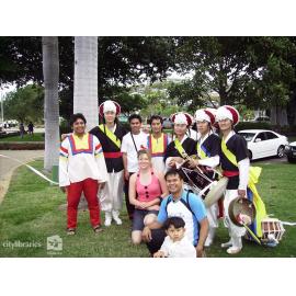 Performers from Suwon City Korea, with members of the public after the Tropigo Carnival parade at Cultural Fest, The Strand, Townsville, 18 August 2007