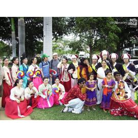 Performers from Suwon City Korea, with members of the Indian Cultural Society after the Tropigo Carnival parade at Cultural Fest, The Strand, Townsville, 18 August 2007