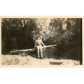 Person posing next to a creek, 1948