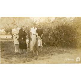 Group posing with a kangaroo, 1948