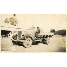 Person sitting on a tractor, 1934