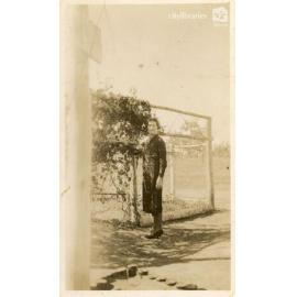Person posing in a garden, 1939