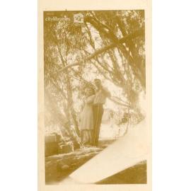 Couple posing under some trees, Paluma, Townsville, 1937