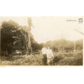 Couple posing in a garden, December 1946