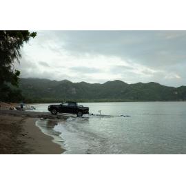 People unload boat from a ute, Horseshoe Bay, Townsville, 3 April 2024
