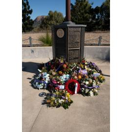 Wreaths in front of a flag pole at Kissing Point Fort, North Ward, Townsville, 16 August 2025
