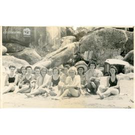 Group of women on a beach, [Townsville], ca. 1945