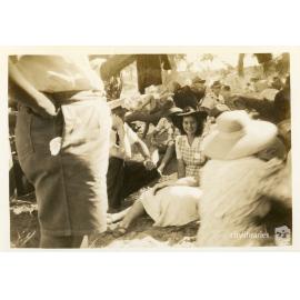 Woman posing for a photograph, amongst a group, Townsville, ca. 1946
