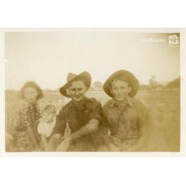 Bill and Les with unidentified woman and child, Townsville, ca. 1946
