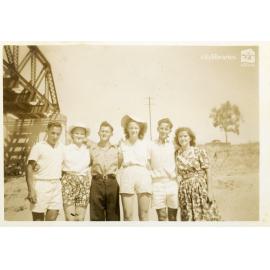 Group posing for a photograph under a bridge, Townsville, ca. 1946